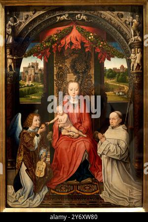 Vierge à l'Enfant sur un trône avec un ange et l'abbé Christian de Hondt, Entre 1499 et 1509, Flandre, d'après Hans Memling (vers. 1435-1440-1494), animale domestico Foto Stock