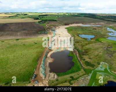 Vista aerea dal drone del cantiere del nuovo campo da golf MacLeod presso il campo da golf Trump International Golf Links sulla costa di Balmedie ad Aberdeen, Aber Foto Stock