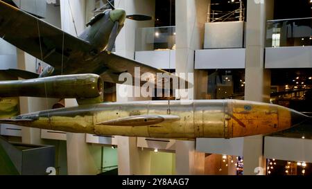 Fieseler Fi-103 V1 Flying Bomb and Spitfire Mk Ia R6915. Imperial War Museum, Lambeth Road, Southwark, London, England. Stock Photo