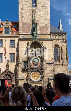 People visting Prague astronomical clock on Old Town Hall in Prague, Czech Republic. Stock Photo