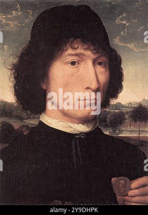 MEMLING, Hans (nato ca. 1440, Seligenstadt, d. 1494, Bruges) Ritratto di un uomo con una moneta romana 1480 o più tardi olio su pannello di quercia, 31 x 23,2 cm Koninklijk Museum voor Schone Kunsten, Anversa oltre al Ritratto di un uomo con una lettera a Firenze, questo è l'unico ritratto di Memling in cui il soggetto guarda direttamente allo spettatore. Le due opere condividono anche altre caratteristiche: La tunica nera abbottonata senza bordi in pelliccia; la camicia ripiegata sul colletto; il cofano nero corto indossato sui capelli scuri e ricci; la composizione del paesaggio; e i bordi seghettati delle nuvole nel cielo. Il Foto Stock
