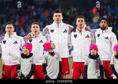 REYKJAVIK, ISLANDA - 11 OTTOBRE 2024: Wales' Connor Roberts, Wales' Harry Wilson , Wales' Kieffer Moore , Wales' Brennan Johnson e Wales' Sorba Tho Foto Stock