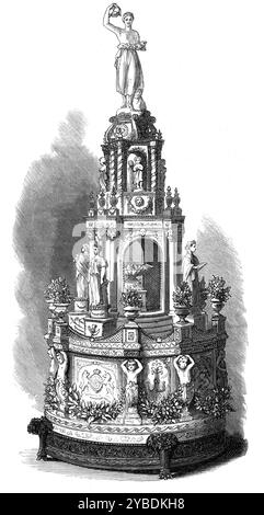 Matrimonio della principessa Luisa: Royal Wedding Cake, 1871. Torta fatta per il matrimonio della principessa Luisa (quarta figlia della regina Vittoria) e di suo marito John Campbell, IX duca di Argyll, incisione da una fotografia dei signori Hills e Saunders. "La principale torta nuziale, che veniva messa sul tavolo a colazione o a pranzo nella Waterloo Chamber, era... una magnifica opera d'arte pasticcera, realizzata dal pasticcere capo di sua Maestà al Castello di Windsor. Era di 5 piedi. 4 poll. alto, con un diametro di 2 ft. 6 poll. La base era decorata con raso bianco, con stemmi, le iniziali e. Foto Stock