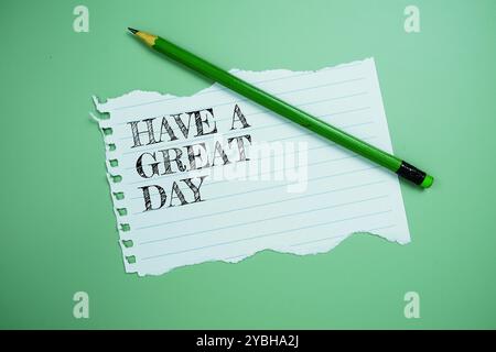 Fai scrivere un testo della giornata su carta strappato con la vista dall'alto a matita su sfondo blu Foto Stock