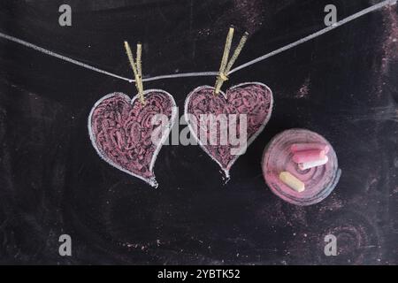 Fatto rappresentazione grafica con il gesso sulla lavagna simbolo dell amore, il cuore Foto Stock