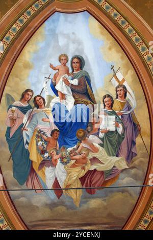 Beata Vergine Maria con Gesù bambino, santi e un Foto Stock