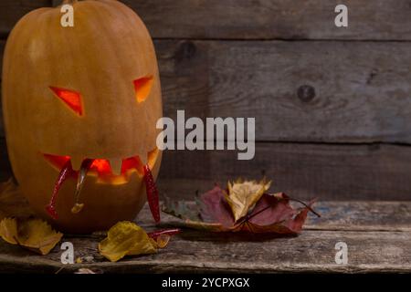 Testa di zucca di Halloween con bastoncini da pesca Foto Stock