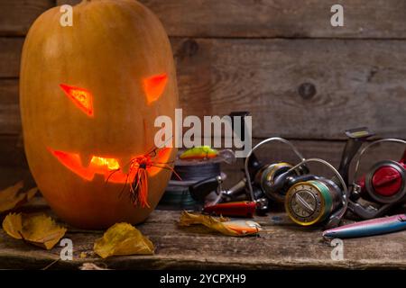 Testa di zucca di Halloween con bastoncini da pesca Foto Stock