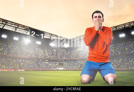 Triste giocatore di calcio Foto Stock