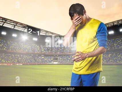 Triste giocatore di calcio Foto Stock