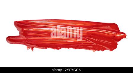 Un'audace traccia di vernice rossa si estende su una superficie bianca pulita Foto Stock