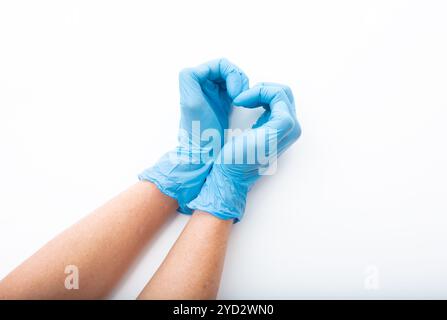 Guanti medici mani a forma di cuore Foto Stock