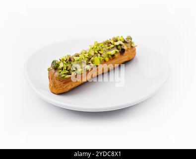 Deliziosa eclair con pistacchio e panna Foto Stock