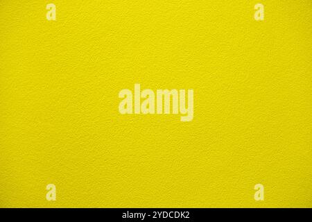Sfondo giallo in cemento, struttura senza cuciture di pareti gialle in cemento, parete in intonaco verniciato semplice Foto Stock