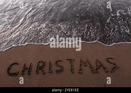 Iscrizione di Natale 2005 sulla spiaggia estiva Foto Stock
