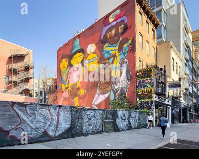 Murale di street art raffigurante B-Boys con Ghetto Blasters, su unità di aria condizionata in mattoni a chelsea, New york, usa Otavio Gustavo Pandolfo Foto Stock