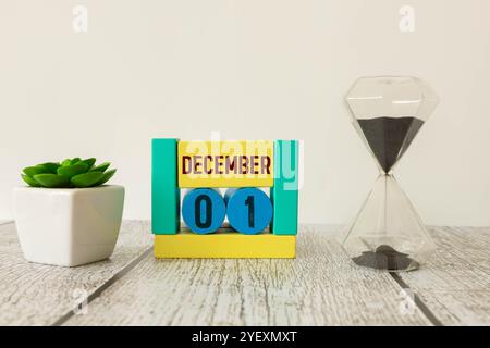 Dicembre 1st. Immagine del calendario di dicembre 1 di colore legno su sfondo di mattone bianco. Spazio vuoto per il testo. Foto Stock