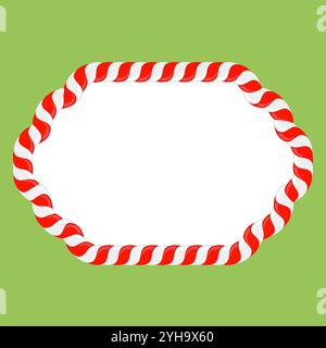 Cornice in canna di caramelle natalizie con strisce rosse e bianche su sfondo verde. Confine di Natale. Foto Stock