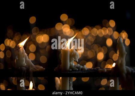 Candles burning in the votive room of the Sanctuary of Our Lady of Rocio, El Rocio village, Almonte, Huelva province, Andalusia, Spain. Stock Photo