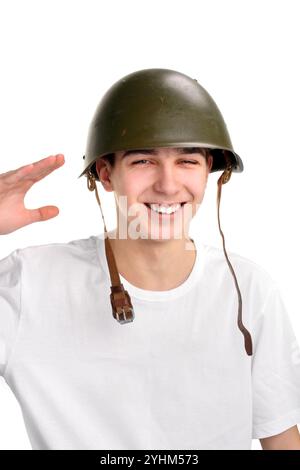 L'adolescente con un casco militare Foto Stock