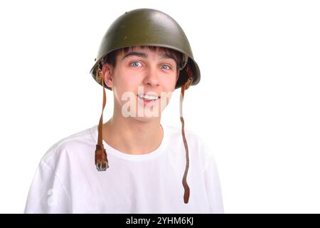 L'adolescente con un casco militare Foto Stock