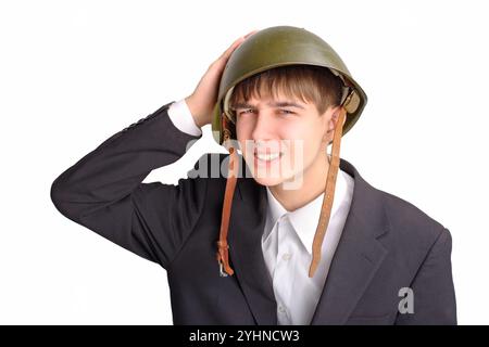 L'adolescente con un casco militare Foto Stock