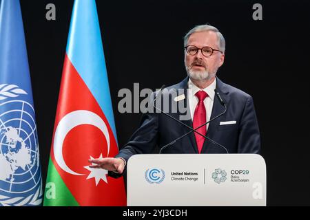 Baku, Azerbaigian. 13 novembre 2024. Petr fiala, primo ministro della Cechia, parla durante la prima parte della Conferenza sul cambiamento climatico delle Nazioni Unite nella sala plenaria di Nizami durante il COP29, un evento tenuto dall'UNFCCC allo stadio olimpico di Baku. La COP29, in vigore dal novembre 11-22, si concentra sulla compensazione delle emissioni di carbonio e sui finanziamenti per la sostenibilità e la mitigazione. Credito: SOPA Images Limited/Alamy Live News Foto Stock