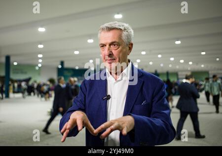 Baku, Azerbaigian. 12 novembre 2024. L'alto Commissario delle Nazioni Unite per i rifugiati Filippo grandi intervista a Xinhua a Baku, Azerbaigian, 12 novembre 2024. Secondo un rapporto pubblicato martedì, le persone sfollate con la forza si trovano sempre più in prima linea nella crisi climatica globale. PER ANDARE CON "il cambiamento climatico rappresenta una crescente minaccia per gli sfollati: Rapporto" credito: Meng Jing/Xinhua/Alamy Live News Foto Stock