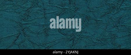 Blu scuro dello sfondo ondulato a partire da un materiale tessile. Tessuto con trama di piegatura closeup. Cordonato lucido panno turchese. Foto Stock