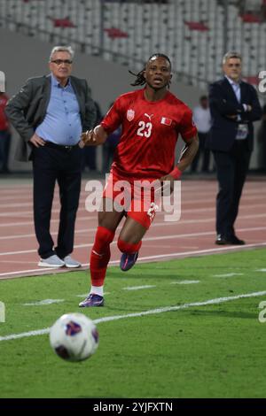 Riffa, Bahrein. 14 novembre 2024. Vincent Emmanuel del Bahrein partecipa alla partita del gruppo C di qualificazione asiatica della Coppa del mondo 2026 tra Cina e Bahrein a Riffa, Bahrein, 14 novembre 2024. Crediti: Wang Haizhou/Xinhua/Alamy Live News Foto Stock