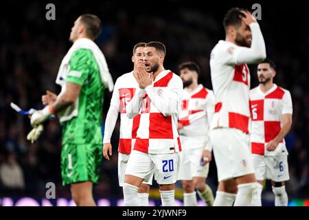 Il croato Marko Pjaca (centro) reagisce dopo la sconfitta nella partita del gruppo A1 della UEFA Nations League ad Hampden Park, Glasgow. Data foto: Venerdì 15 novembre 2024. Foto Stock