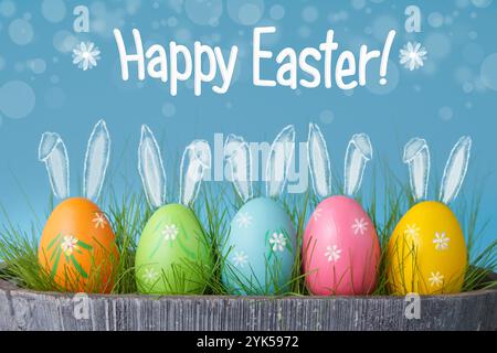 Buona Pasqua. Concetto di festa di Pasqua con deliziose uova e coniglietti Foto Stock