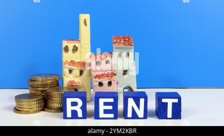 Scrittura AFFITTO investimenti immobiliari. Concetto di gestione della ricchezza finanziaria monete in euro. Foto Stock