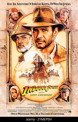 Indiana Jones and the Last Crusade (1989) diretto da Steven Spielberg e interpretato da Harrison Ford, Sean Connery e Denholm Elliott. Un archeologo si imbarca in una ricerca per trovare il Santo Graal mentre salva suo padre dalle forze naziste. Fotografia di un poster originale degli Stati Uniti del 1989 con un foglio con opere d'arte di Drew Struzan ***SOLO PER USO EDITORIALE***. Credito: Immagini BFA/Paramount Foto Stock