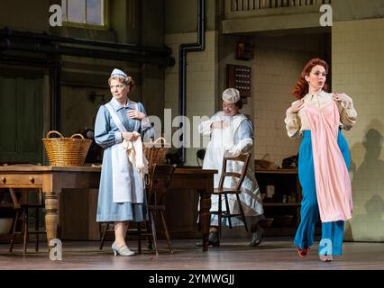 Front left: Fiona Canfield right: Rhian Lois (Adina) in THE ELIXIR OF LOVE at English National Opera, London Coliseum, London WC2 15/11/2024 musica: Gaetano Donizetti libretto: Felice Romani traduzione inglese: Amanda Holden direttore: Teresa Riveiro Bohm Set design: Nicky Shaw costumi: Zehra Mansouri illuminazione: Mark Jonathan Movement: Anjali Mehra direttore: Harry Fehr Foto Stock