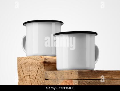 Modello di due tazze di ferro bianche con bordo nero, su vecchie travi di legno, tazze da viaggio in metallo, su legno testurizzato, per design, branding. Tazza in smalto per mockup Foto Stock