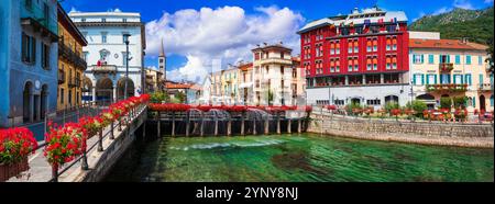 Italia, lago d'Orta. (Lago di Orta). Pittoresca cittadina colorata di Omegna con affascinanti canali e strade floreali Foto Stock