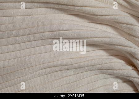 Pullover in maglia beige. Concetto di background Foto Stock