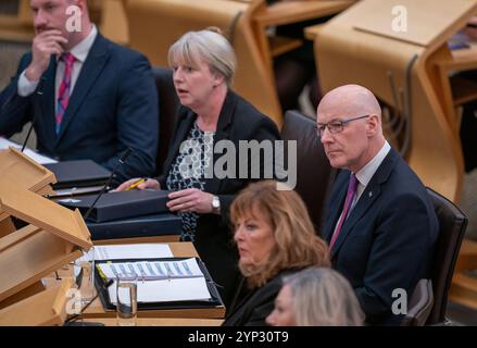 Il primo ministro della Scozia John Swinney durante le interrogazioni del primo ministro al Parlamento scozzese a Holyrood, Edimburgo. Data foto: Giovedì 28 novembre 2024. Foto Stock