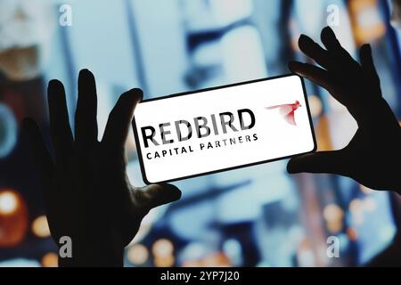 In questa immagine, il logo Redbird Capital Partners viene visualizzato sullo schermo di uno smartphone Foto Stock