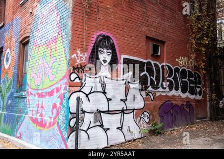 Bottiglia d'inchiostro e murale femminile in Renfrew Place nel centro di Toronto, Ontario, Canada Foto Stock