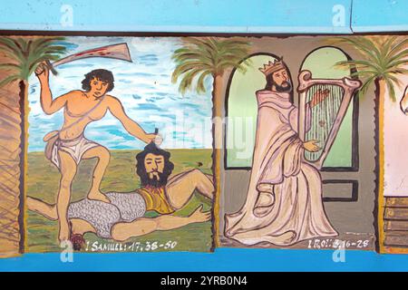 Affreschi biblici sulle pareti della chiesa di nostra Signora del Lago, cattedrale Notre Dame de Togoville, Togoville, Togo Foto Stock