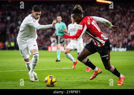 Bilbao, Spagna, Spagna. 4 dicembre 2024. Federico VALVERDE del Real Madrid e Nico WILLIAMS dell'Athletic Club durante la partita di LaLiga tra Athletic Club e Real Madrid CF allo stadio San Mames il 4 dicembre 2024 a Bilbao, Spagna. (Credit Image: © Matthieu Mirville/ZUMA Press Wire) SOLO PER USO EDITORIALE! Non per USO commerciale! Foto Stock