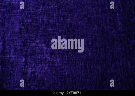 Sfondo astratto della trama di velluto del tessuto di fabbrica in blu scuro. Il colore alla moda dell'anno. stendere per il design. Uno spazio di copia. saturazione del colore Foto Stock