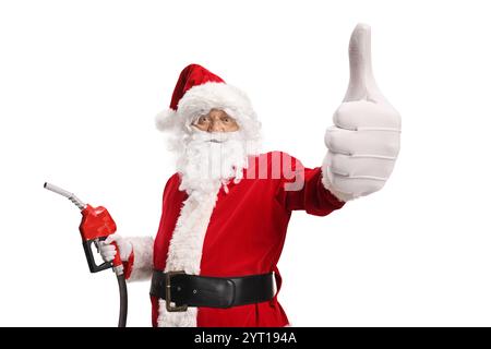 Babbo Natale con una pistola ad iniezione carburante e i pollici gestanti si alzano isolati su sfondo bianco Foto Stock