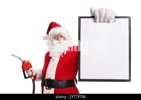 Babbo Natale con una pistola ad iniezione di carburante e un documento cartaceo in bianco Foto Stock