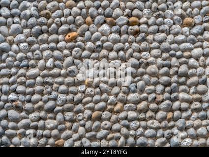 Primo piano full frame di un muro di ciottoli visto in Francia Foto Stock