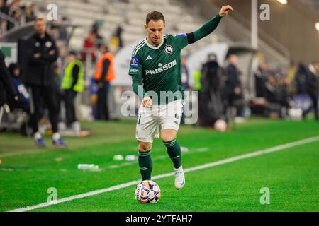 Lodz, Polonia. 5 dicembre 2024. Kacper Chodyna di LKS visto in azione durante la partita di Coppa di Polonia tra LKS Lodz e Legia Warszawa al Wladyslaw Krol Municipal Stadium. Punteggio finale; LKS Lodz 0:3 Legia Warszawa. Credito: SOPA Images Limited/Alamy Live News Foto Stock