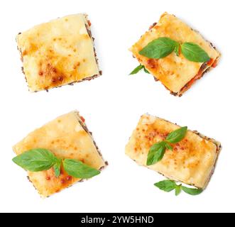 Set di deliziose lasagne isolate su bianco. Vista dall'alto Foto Stock