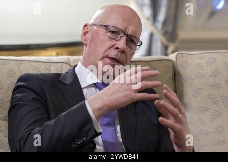Foto del file del 06/12/24 del primo ministro scozzese John Swinney alla Bute House di Edimburgo, la residenza ufficiale del primo ministro. Il servizio di assistenza nazionale proposto (NCS) in Scozia dovrebbe essere pensato al di fuori di una "architettura istituzionale", ha detto il primo ministro del paese, poiché ha esortato a concentrarsi su come potrebbe migliorare i servizi. Data di pubblicazione: Mercoledì 11 dicembre 2024. Foto Stock